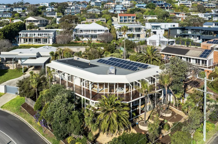 Aerial view of a two-storey Mount Eliza home with solar panels and established gardens
